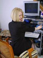 Blonde office MILF strips and spreads her ivory legs