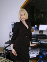 Blonde office MILF strips and spreads her ivory legs