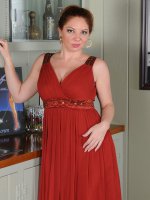 Kiki DAire - Busty auburn haired Kiki D'Aire showing off her 39 year old body