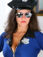 Brunette MILF in a police uniform spreads her long mature legs